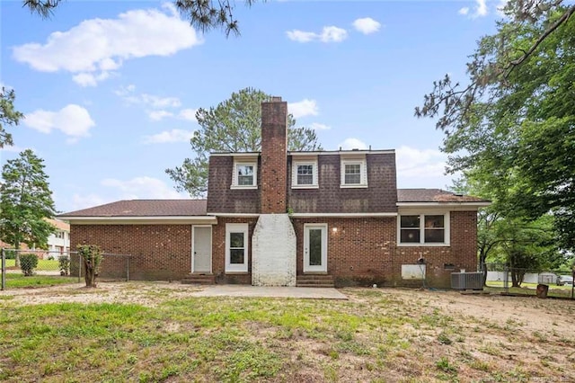 1720 Paisley Ave, Fayetteville, NC 28304 - back of property with entry steps, cooling unit, brick siding, a chimney, and a patio area