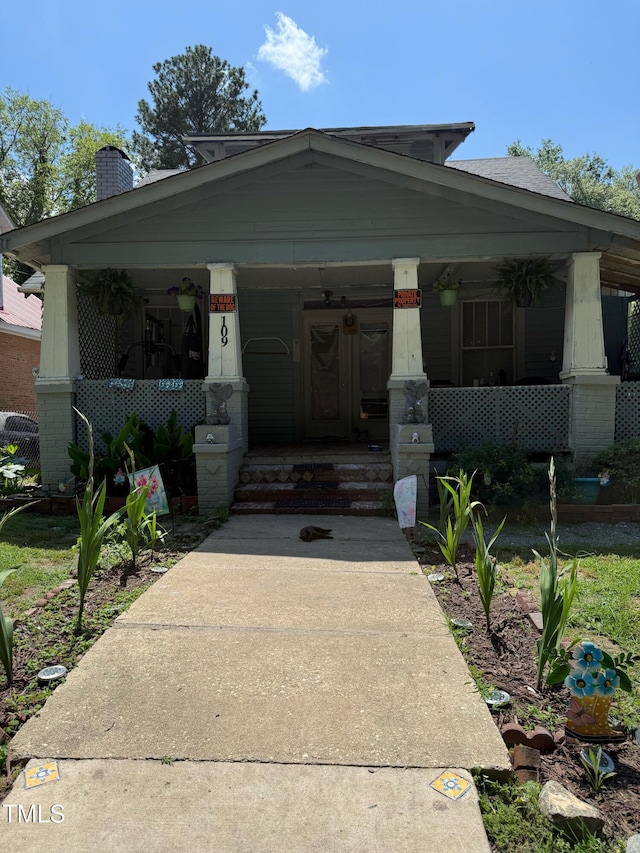 109 N 2nd St, Sanford, NC 27330 - view of front of house featuring a porch and a chimney