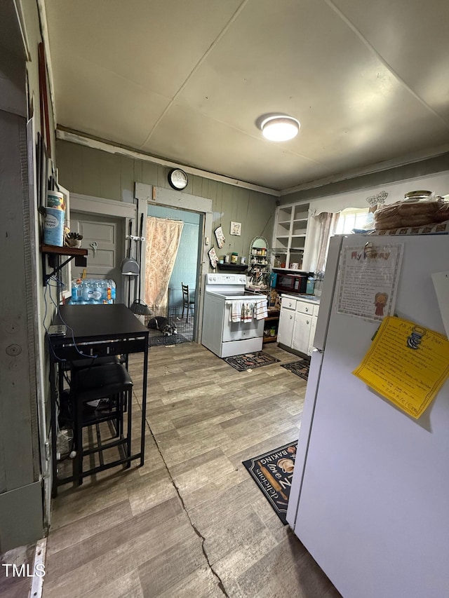 109 N 2nd St, Sanford, NC 27330 - kitchen with white appliances, white cabinets, and light wood-style flooring