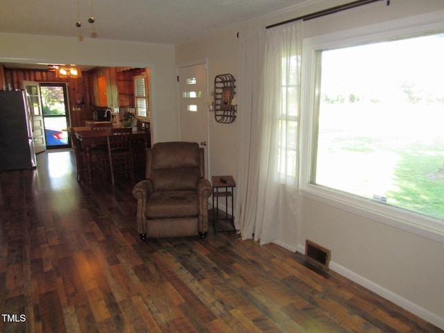 1700 Warrenton Rd, Henderson, NC 27537 - living area featuring dark wood-type flooring and a chandelier