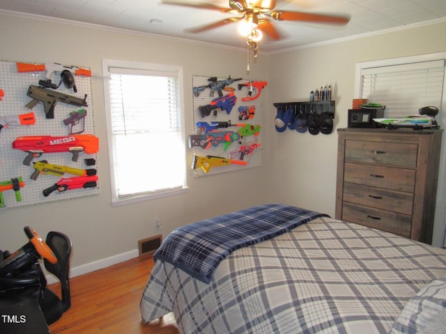 1700 Warrenton Rd, Henderson, NC 27537 - bedroom with wood finished floors, ornamental molding, baseboards, and a ceiling fan