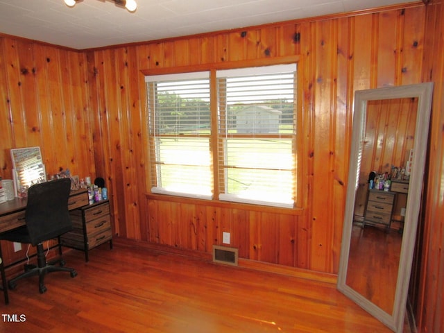 1700 Warrenton Rd, Henderson, NC 27537 - office area featuring wood walls, light wood-type flooring, and baseboards