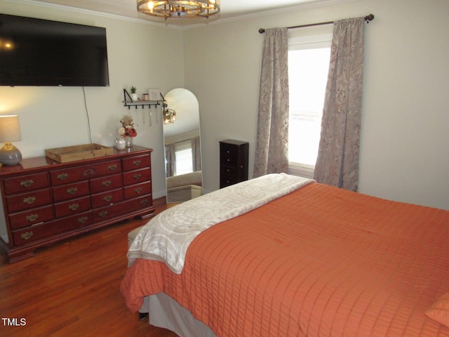1700 Warrenton Rd, Henderson, NC 27537 - bedroom with wood finished floors, ornamental molding, and a chandelier