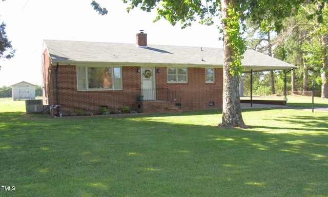 1700 Warrenton Rd, Henderson, NC 27537 - view of front of home featuring brick siding, a front lawn, a chimney, a shed, and cooling unit