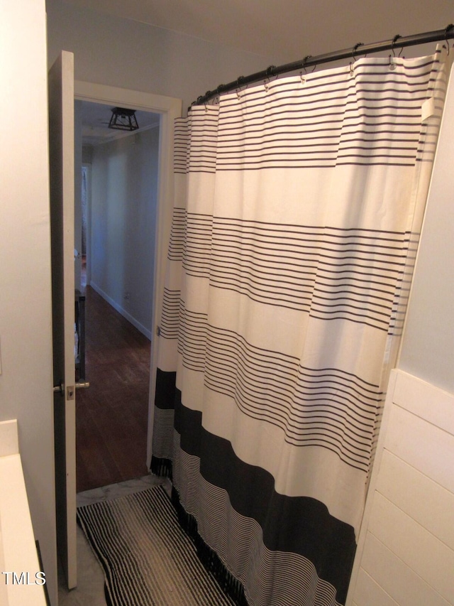 1700 Warrenton Rd, Henderson, NC 27537 - full bathroom with wood finished floors and curtained shower