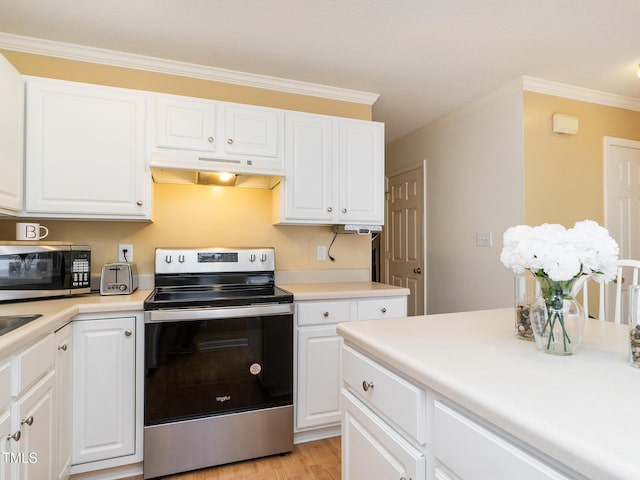 6304 Bermuda Way, Whitsett, NC 27377 - kitchen with appliances with stainless steel finishes, under cabinet range hood, crown molding, white cabinets, and light countertops