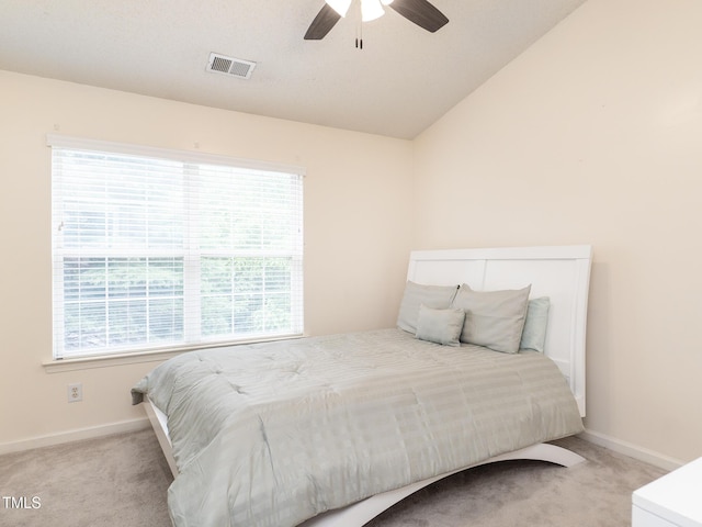 6304 Bermuda Way, Whitsett, NC 27377 - carpeted bedroom with vaulted ceiling and ceiling fan