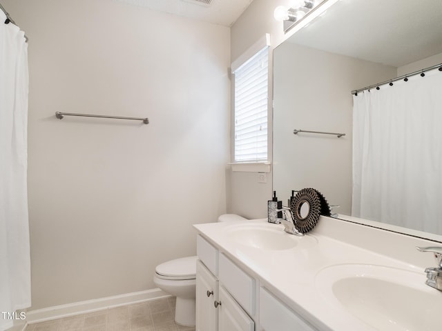 6304 Bermuda Way, Whitsett, NC 27377 - bathroom with double vanity and a shower with curtain