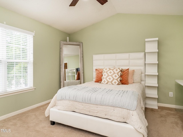 6304 Bermuda Way, Whitsett, NC 27377 - carpeted bedroom featuring multiple windows, vaulted ceiling, and a ceiling fan