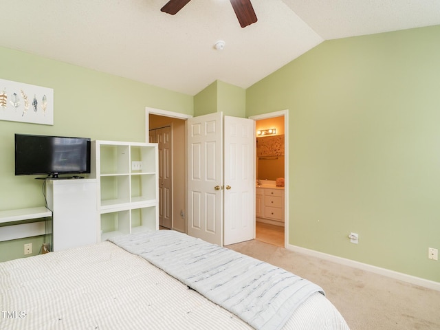 6304 Bermuda Way, Whitsett, NC 27377 - carpeted bedroom featuring lofted ceiling, ensuite bath, and a ceiling fan