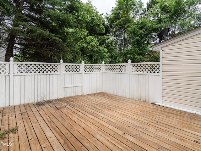 6304 Bermuda Way, Whitsett, NC 27377 - wooden terrace featuring view of wooded area