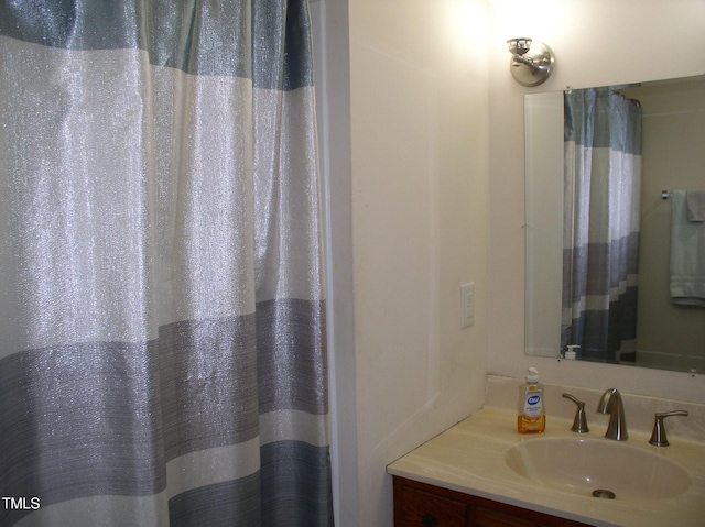 1809 S Garnett Ext, Henderson, NC 27536 - bathroom featuring vanity and curtained shower