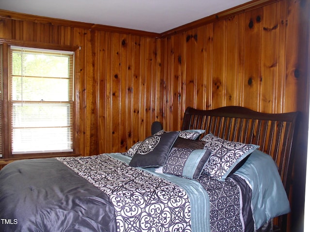 1809 S Garnett Ext, Henderson, NC 27536 - bedroom featuring wooden walls and ornamental molding