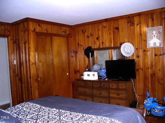 1809 S Garnett Ext, Henderson, NC 27536 - bedroom featuring a closet and wooden walls
