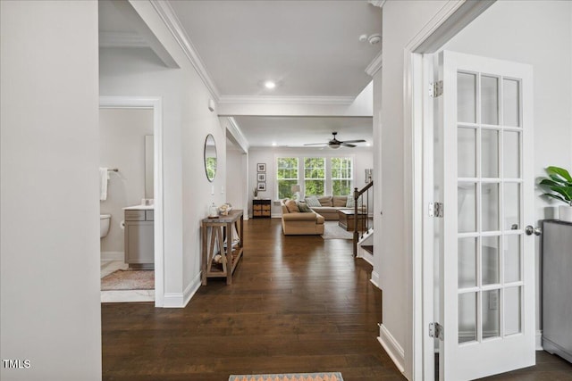 2009 Latham Oaks Ave, Wake Forest, NC 27587 - hallway with crown molding, dark wood-type flooring, recessed lighting, baseboards, and stairway