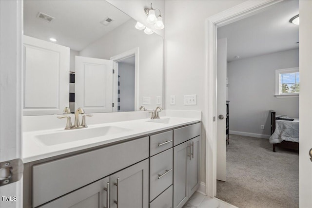 2009 Latham Oaks Ave, Wake Forest, NC 27587 - ensuite bathroom featuring double vanity and baseboards