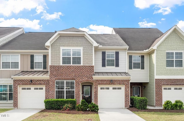 9327 Falkwood Rd, Raleigh, NC 27617 - view of property with brick siding, driveway, and a garage