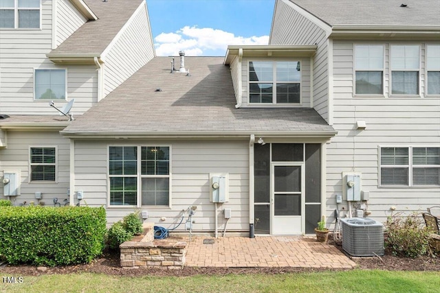 9327 Falkwood Rd, Raleigh, NC 27617 - rear view of property with central air condition unit, a patio, a sunroom, and a shingled roof