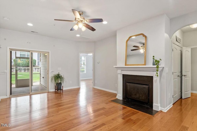 9327 Falkwood Rd, Raleigh, NC 27617 - unfurnished living room with a ceiling fan, plenty of natural light, light wood-type flooring, and recessed lighting