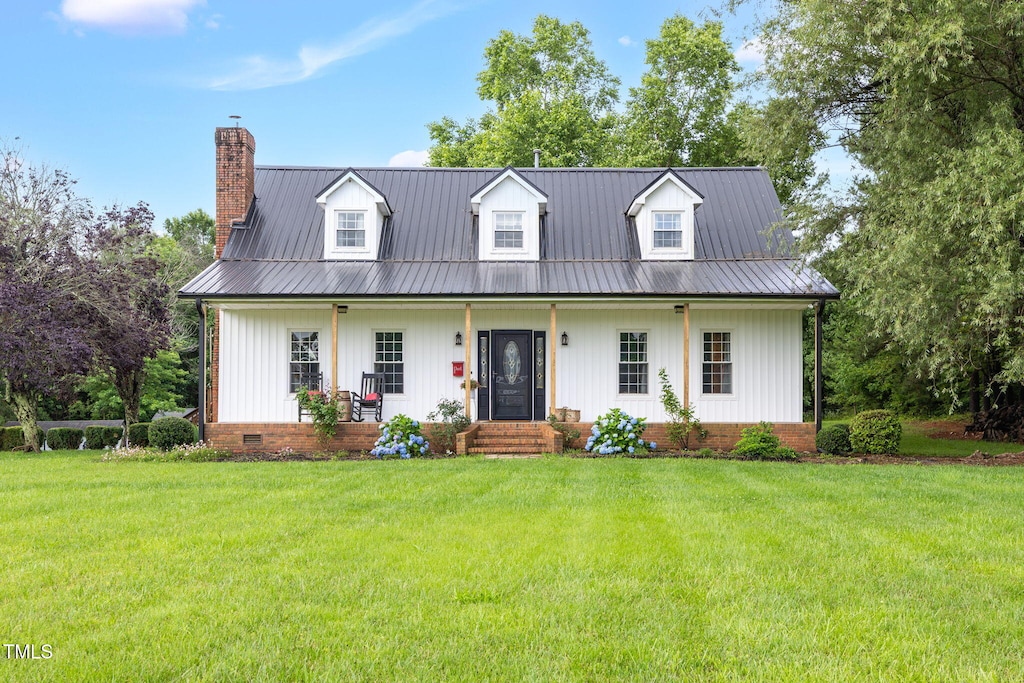 5322 Ironweed Ln, Mcleansville, NC 27301 - view of front of home featuring a chimney, a front lawn, metal roof, and crawl space