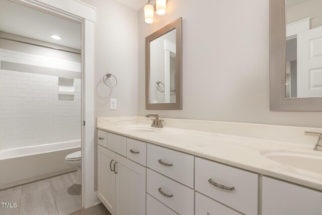 90 Starwood Dr, Garner, NC 27529 - bathroom featuring toilet, double vanity, and bathtub / shower combination