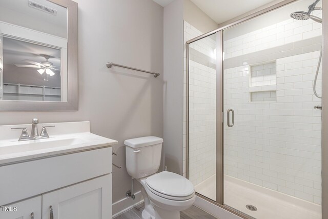 90 Starwood Dr, Garner, NC 27529 - full bathroom with toilet, vanity, a stall shower, and ceiling fan