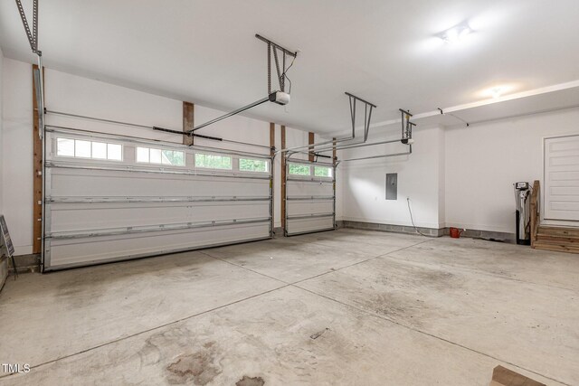 90 Starwood Dr, Garner, NC 27529 - garage with a garage door opener and electric panel