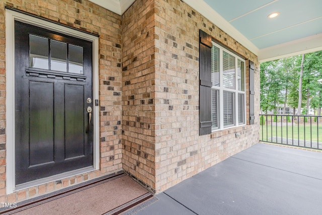 90 Starwood Dr, Garner, NC 27529 - doorway to property with covered porch and brick siding