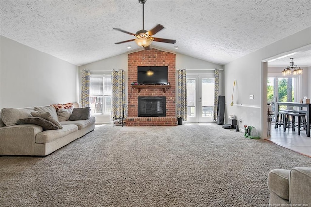 7578 Firethorn Dr, Fayetteville, NC 28311 - living area featuring lofted ceiling, ceiling fan, a brick fireplace, a textured ceiling, and carpet