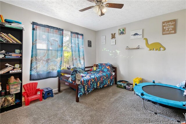 7578 Firethorn Dr, Fayetteville, NC 28311 - bedroom with carpet flooring, a textured ceiling, and a ceiling fan
