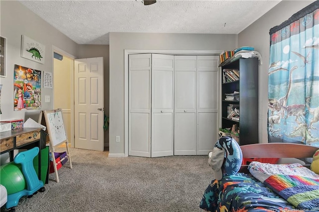 7578 Firethorn Dr, Fayetteville, NC 28311 - carpeted bedroom featuring a closet and a textured ceiling