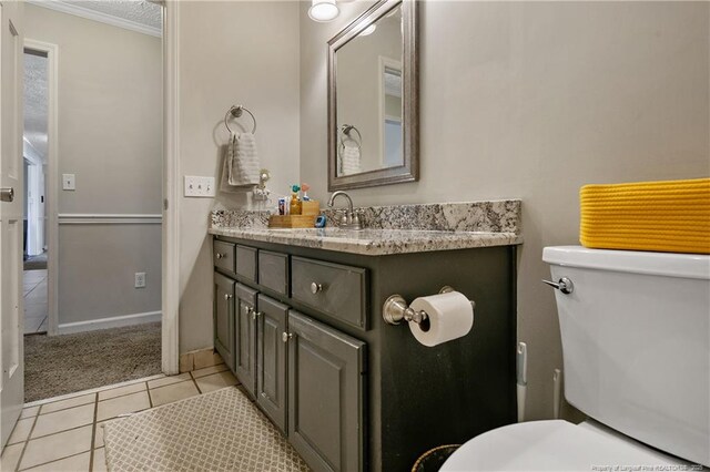 7578 Firethorn Dr, Fayetteville, NC 28311 - bathroom with vanity, toilet, and tile patterned flooring