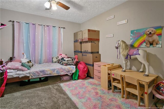 7578 Firethorn Dr, Fayetteville, NC 28311 - bedroom featuring a textured ceiling, carpet flooring, and ceiling fan