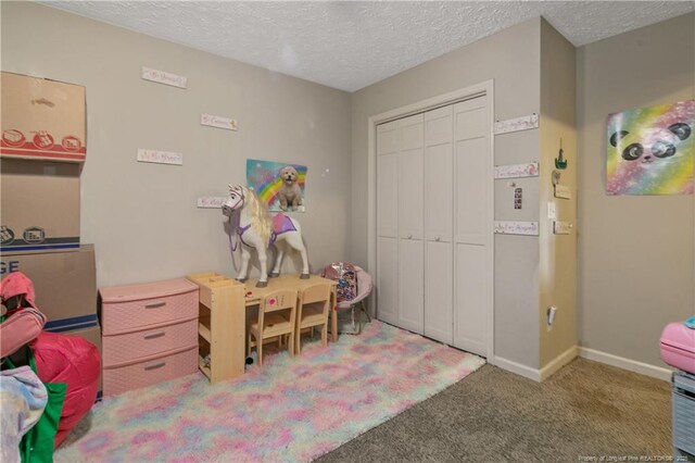 7578 Firethorn Dr, Fayetteville, NC 28311 - recreation room with carpet floors, a textured ceiling, and baseboards