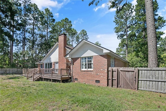 7578 Firethorn Dr, Fayetteville, NC 28311 - rear view of house with crawl space, brick siding, a deck, a gate, and a chimney