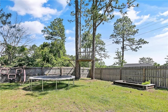 7578 Firethorn Dr, Fayetteville, NC 28311 - view of yard with a trampoline