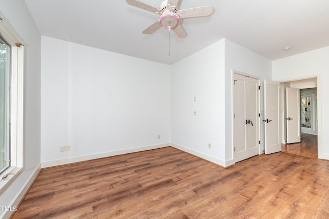 112 Lancaster Dr, Chapel Hill, NC 27517 - unfurnished bedroom featuring light wood-style flooring, baseboards, and a ceiling fan