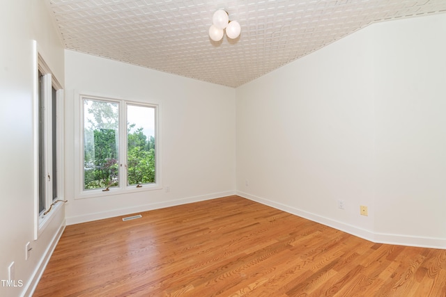112 Lancaster Dr, Chapel Hill, NC 27517 - unfurnished room with light wood-type flooring, baseboards, and vaulted ceiling
