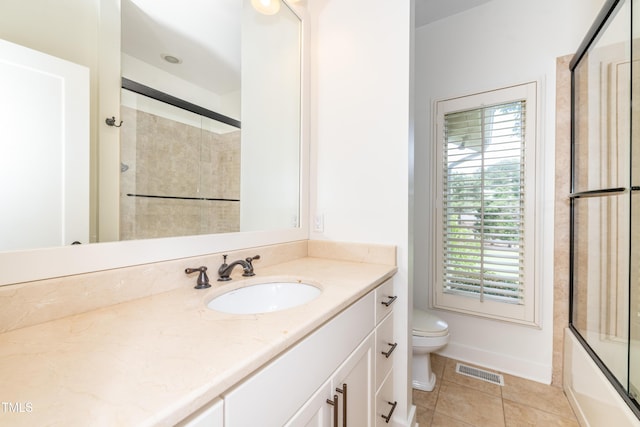 112 Lancaster Dr, Chapel Hill, NC 27517 - bathroom with toilet, vanity, tile patterned flooring, and combined bath / shower with glass door
