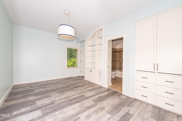 112 Lancaster Dr, Chapel Hill, NC 27517 - unfurnished bedroom featuring light wood-type flooring, baseboards, and ensuite bathroom