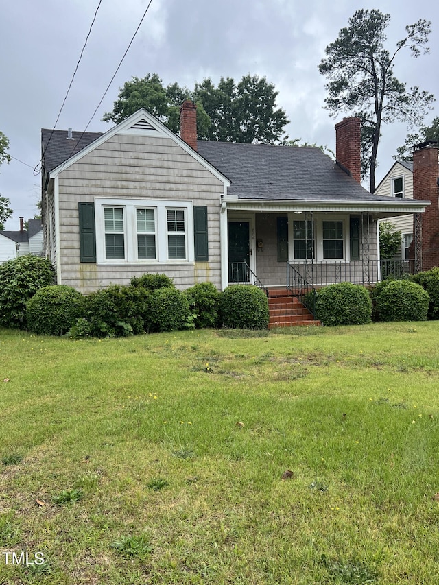 806 Ethelored St, Fayetteville, NC 28303 - view of front of property with a chimney, a porch, and a front lawn