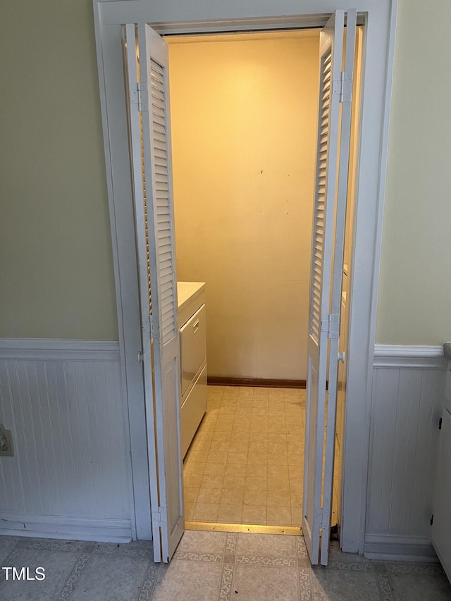 806 Ethelored St, Fayetteville, NC 28303 - hallway with a wainscoted wall and independent washer and dryer
