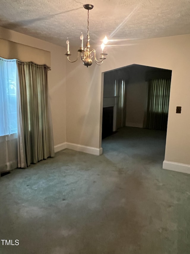 806 Ethelored St, Fayetteville, NC 28303 - unfurnished room with a chandelier, baseboards, a textured ceiling, and carpet