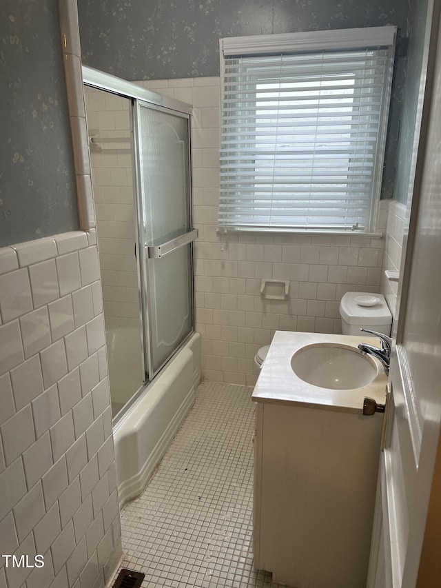 806 Ethelored St, Fayetteville, NC 28303 - full bath with tile walls, toilet, a wainscoted wall, enclosed tub / shower combo, and vanity