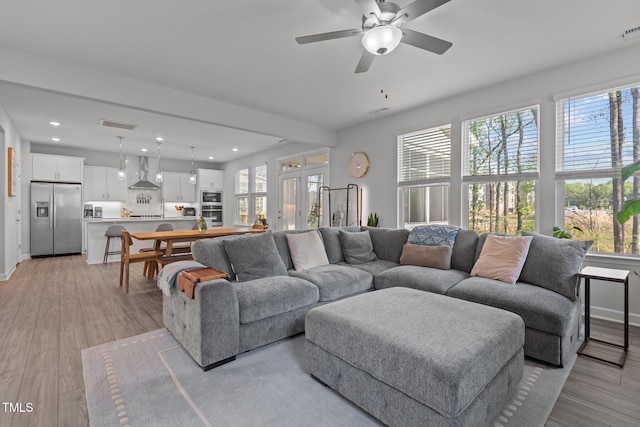 604 Craftsman Ridge Trl, Knightdale, NC 27545 - living room with a ceiling fan, recessed lighting, light wood-type flooring, and baseboards