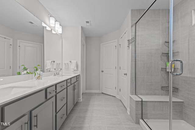 604 Craftsman Ridge Trl, Knightdale, NC 27545 - full bathroom with double vanity, a stall shower, and baseboards
