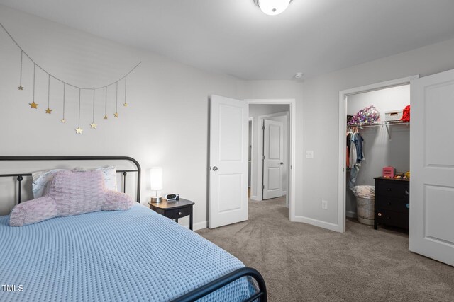 604 Craftsman Ridge Trl, Knightdale, NC 27545 - carpeted bedroom featuring baseboards, a walk in closet, and a closet