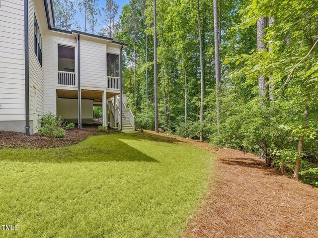 67 Spring Hollow Ct, Pittsboro, NC 27312 - view of green lawn featuring stairs and a sunroom