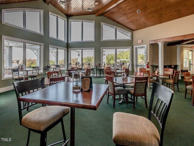 67 Spring Hollow Ct, Pittsboro, NC 27312 - dining room featuring carpet, wooden ceiling with exposed beams, and high vaulted ceiling