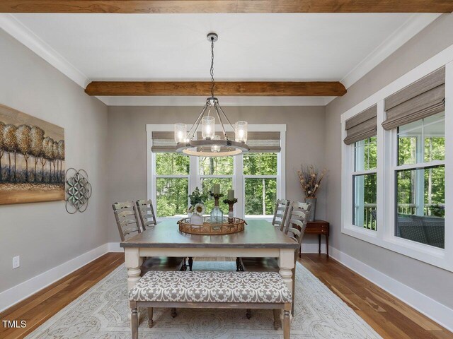 67 Spring Hollow Ct, Pittsboro, NC 27312 - dining room with a chandelier, healthy amount of natural light, wood finished floors, beam ceiling, and baseboards